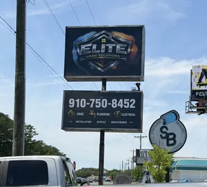 The Elite Home Solutions roadside sign in Jacksonville, NC