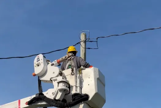 An Elite Home Solutions electrician working from a bucket truck in eastern North Carolina