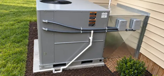 A residential packaged HVAC unit installed beside a Jacksonville home